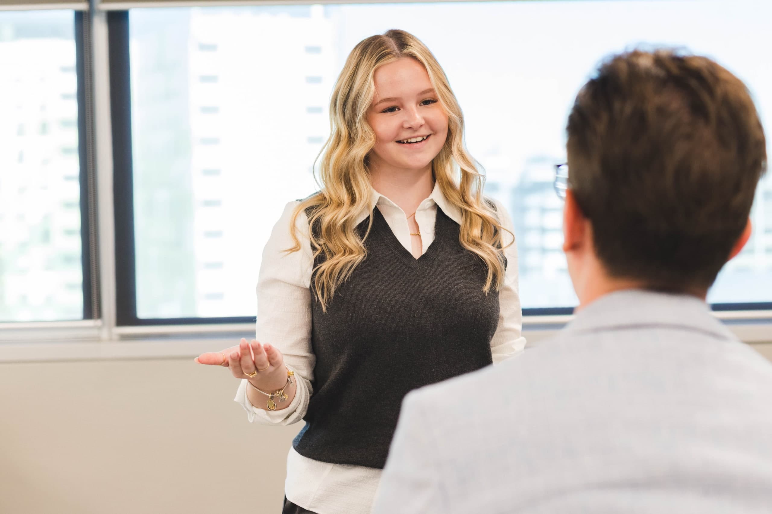 Insurance professional presenting to a colleague in an office meeting