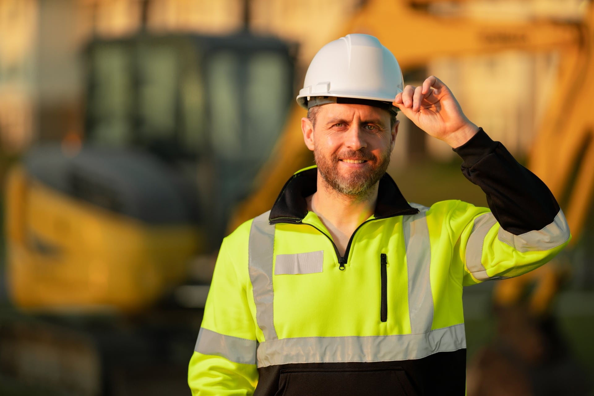Construction worker on building site in helmet